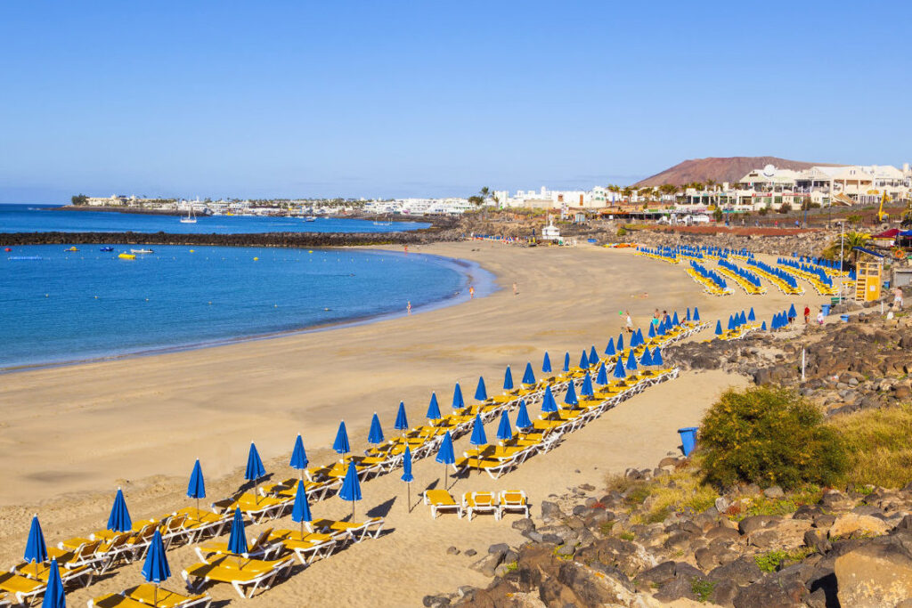 Playa Dorada with Montana Roja in the background Lanzarote