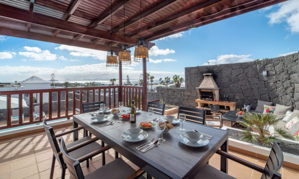 playa blanca dining table outdoors sea view