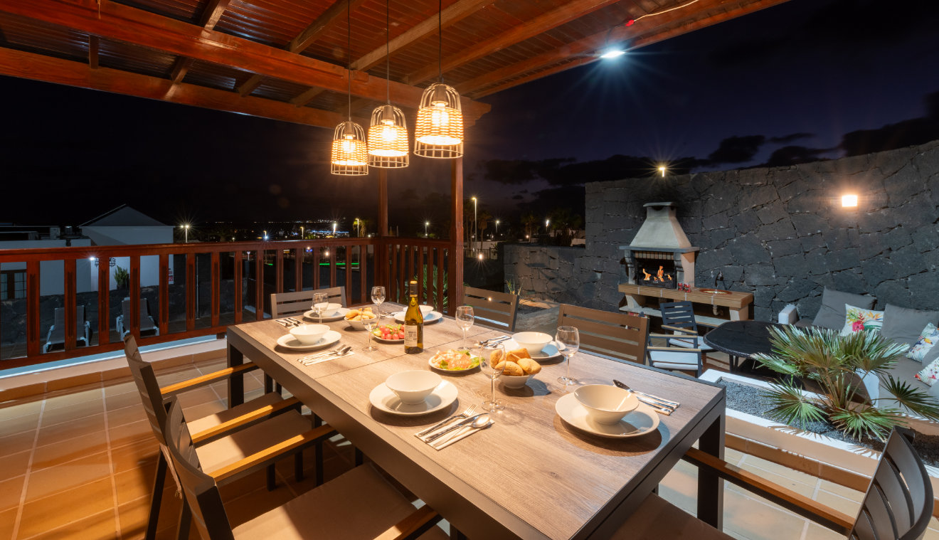outdoor dining playa blanca night view to sea